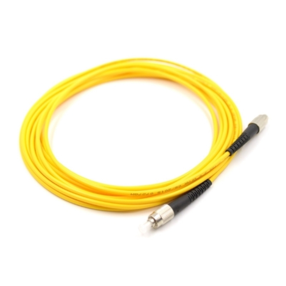 Close-up of threaded metal FC/UPC connectors on single mode duplex fiber patch cable