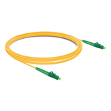 Close-up of green LC/APC connectors on a single mode simplex fiber patch cable