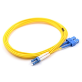 Close-up of blue LC/UPC and SC/UPC hybrid connectors on single mode duplex fiber patch cable