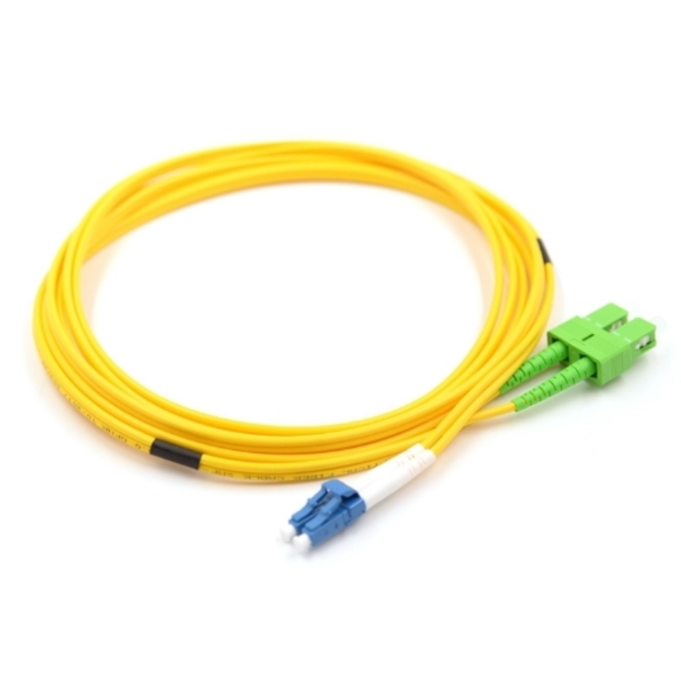Close-up of blue LC/UPC and green SC/APC hybrid connectors on single mode duplex fiber patch cable