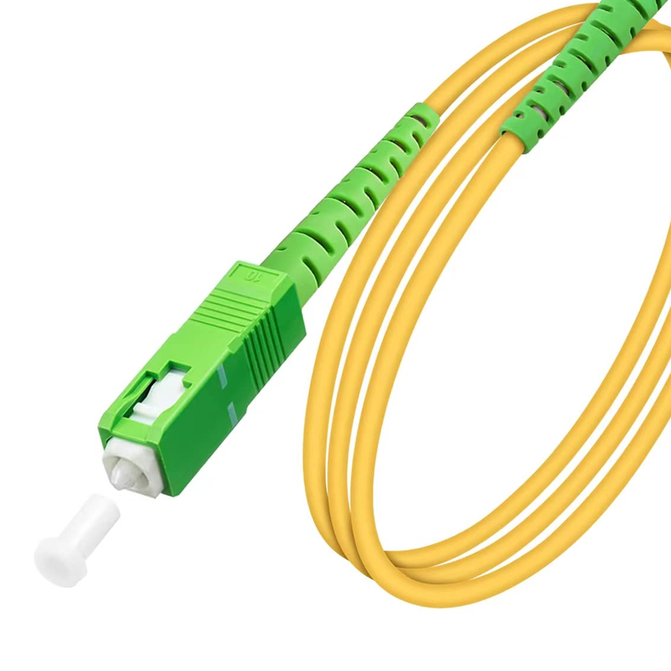 Close-up of green SC/APC connector ferrule showing 8-degree angled physical contact polish