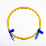 Close-up of blue SC/UPC connectors on a single mode simplex fiber patch cable